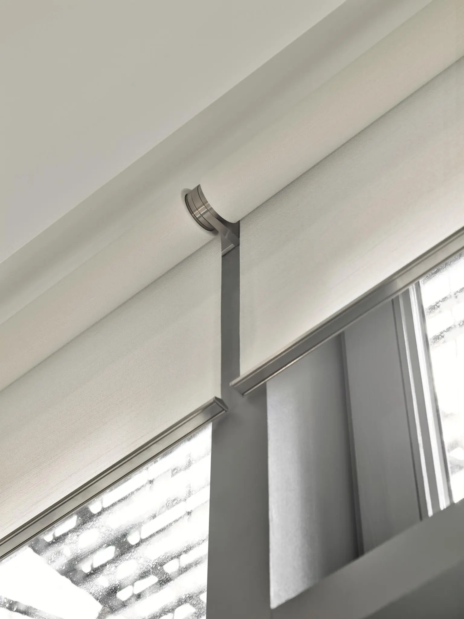 Lutron automated shades wound around roller